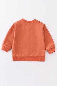 Orange sweatshirt