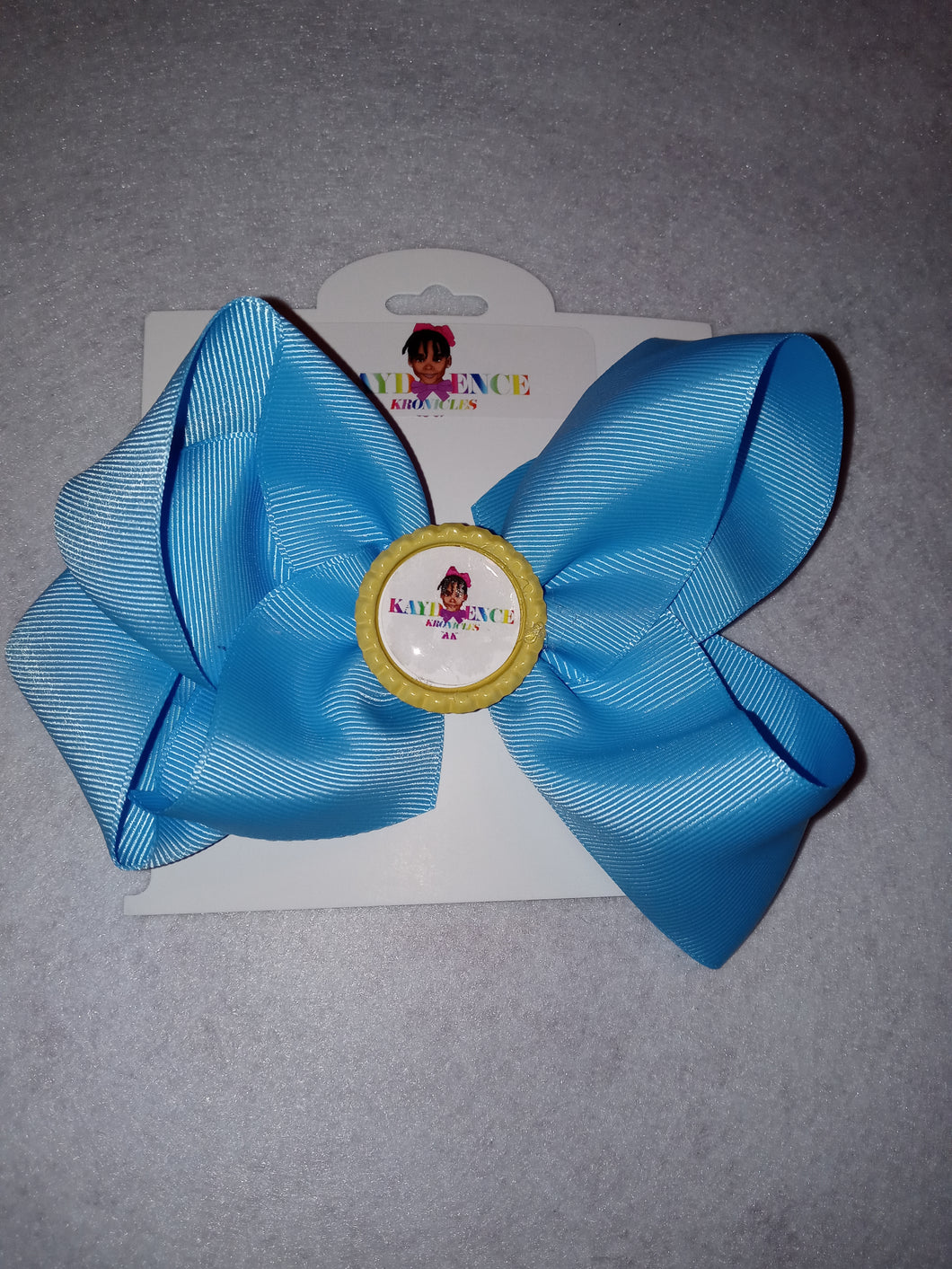 6 Inch Solid Colored Hair Bow with Kaydence Kronicles Logo